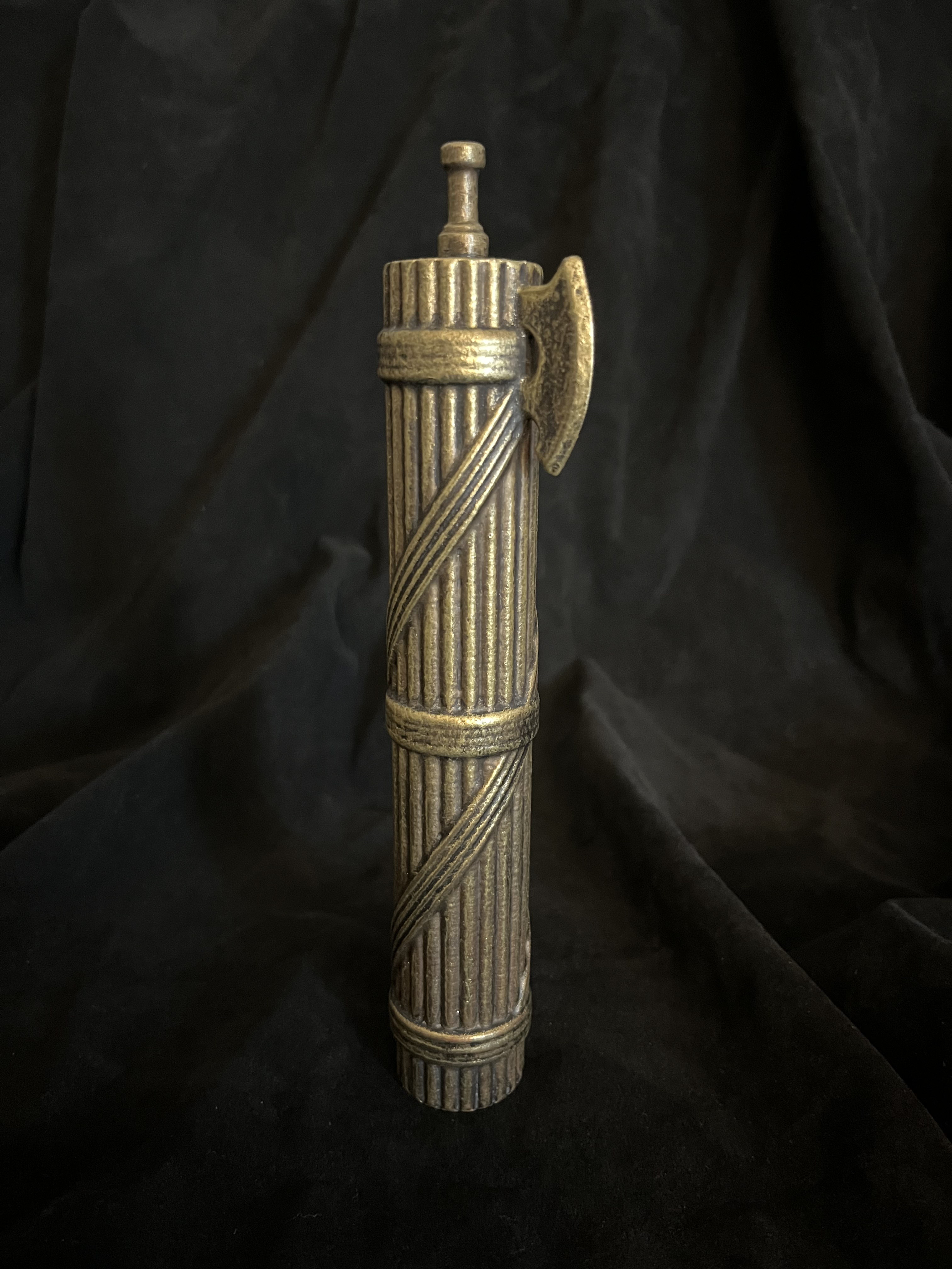 Upright front view of the fasces on a dark background.
