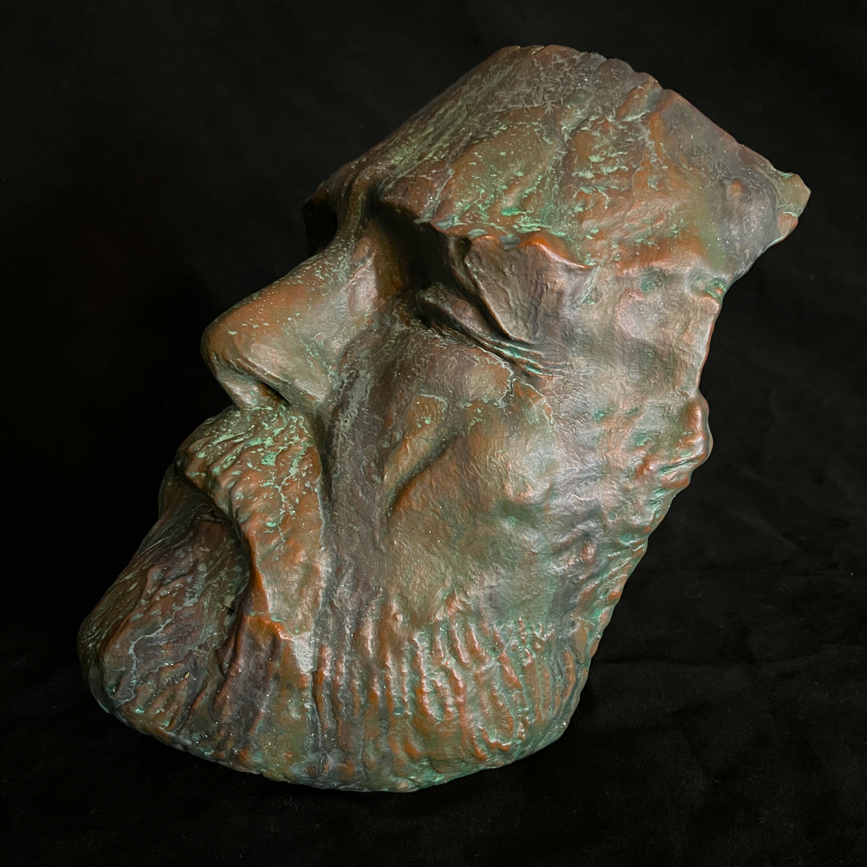 Angled frontal view of a patinated bronze-finish replica of Robert E. Lee's face.